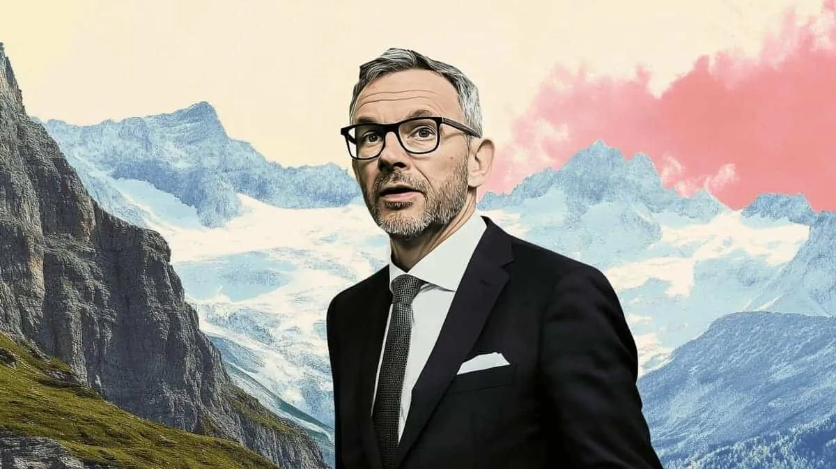 Man in suit and glasses, mountains background.